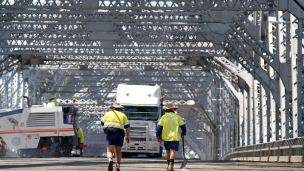 Brisbane City Council workers brave hot temperatures on the weekend to resurface the road on the Story Bridge. The bridge was last resurfaced 20 years ago.