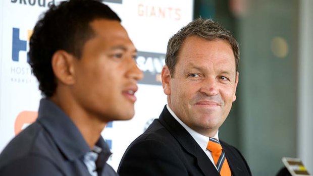 Star GWS recruit Israel Folau with Dale Holmes at a press conference in March this year.