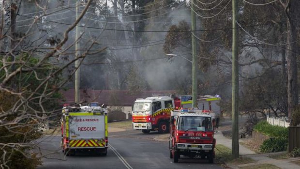 Fire trucks patrol Winmalee after the bushfire on Friday.