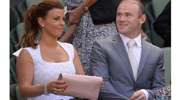 Wayne Rooney and his wife, Coleen, attend the men's singles final at Wimbledon.
