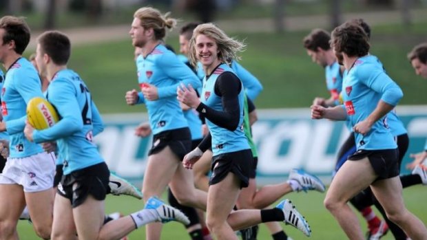 On the move: Essendon players at training on Tuesday.