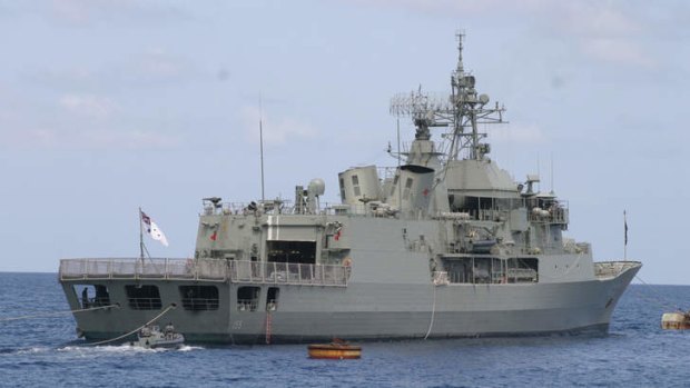 The HMAS Ballarat tried to turn a boat carrying 56 suspected asylum seekers back to Indonesia before the wooden vessel's engine failed.