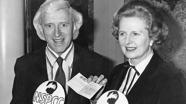 Jimmy Savile pictured in 1980 with his friend Margaret Thatcher at a  function for  the National Society for the Prevention to Cruelty to Children.
