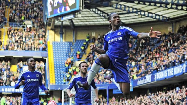 Didier Drogba shows his joy after scoring the opening goal of the game against Stoke City, his 100th in the league.