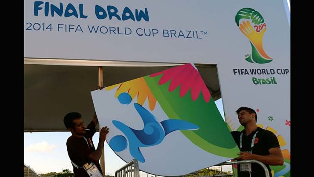 Workers put finishing touches to the entrance to the complex in Costa do Sauipe where the Brazil 2014 FIFA World Cup final draw will take place on December 6.