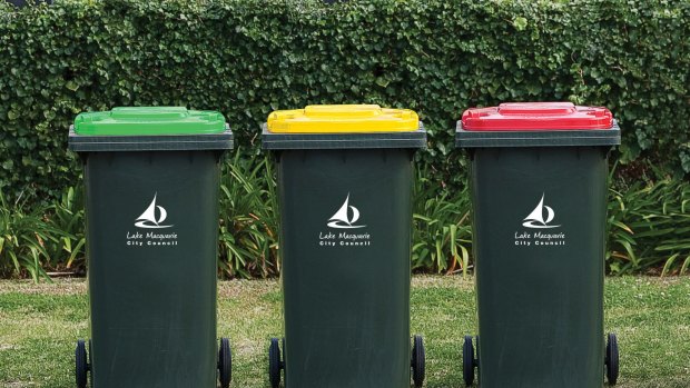 Pictures shows Lake Macquarie's three bins. The green-lid bin is for green waste, the red-lid bin for general waste, the yellow-lid bin for recycling.