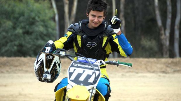 Tyronne Gilks, then aged 16, breaks 125cc motorcycle jump.