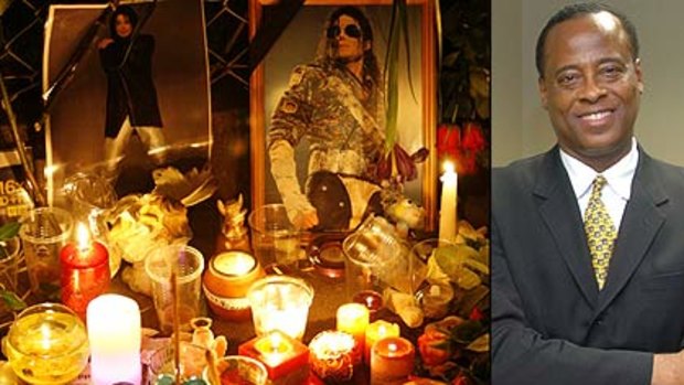 Off the wall ...  candles placed next to portraits outside the US embassy in Moscow yesterday and Michael Jackson's doctor, cardiologist  Conrad Murray who has a tangled financial and personal history.
