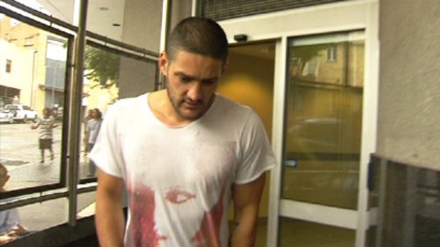 Brendan Fevola leaves the Roma Street watchhouse yesterday after being arrested in the early hours of new year’s day.