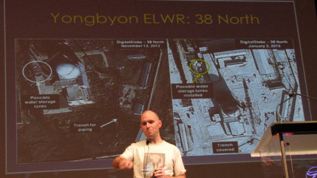 A slide shows two satellite images comparing a rocket launch site on two different days.