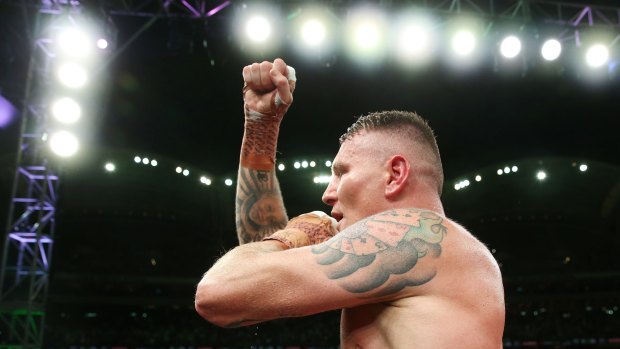 Green celebrates after defeating  Mundine in their cruiserweight bout.
