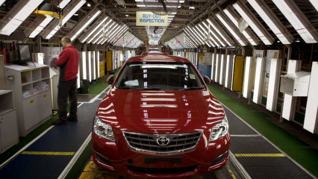A car rolls off the assembly line at Toyota.
