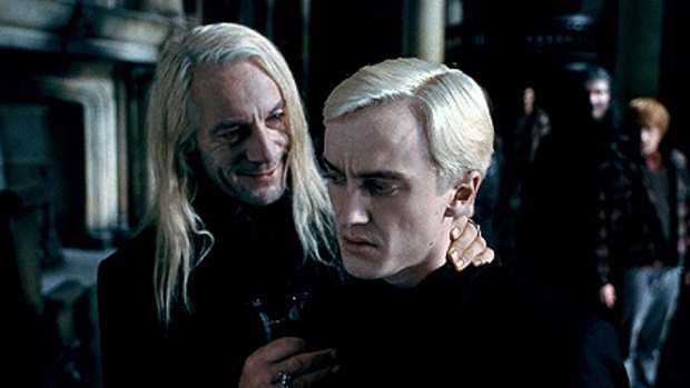 Tom Felton, right, as Draco Malfoy in Harry Potter and the Deathly Hallows.