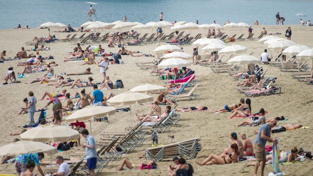 'Beaching' is a favourite pastime for tourists visiting the city: La Marbella beach in Barcelona.
