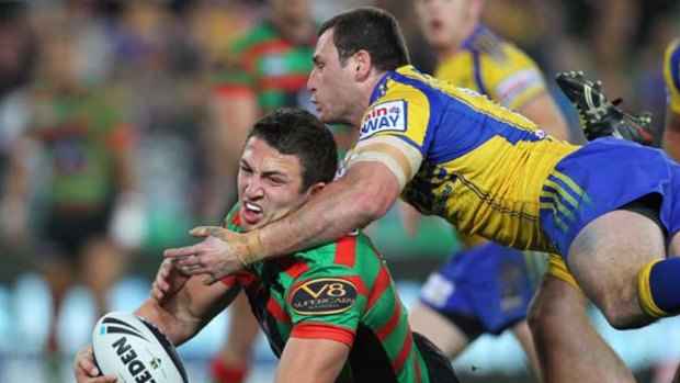 Nothing he hasn't faced before ... South Sydney's English import Sam Burgess is tackled in Friday night's game against the Parramatta Eels at ANZ Stadium.