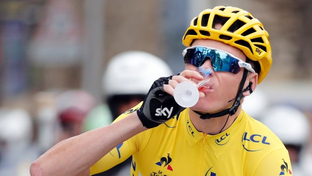 Britain's Chris Froome sips champagne during the twenty-first and last stage of the Tour de France.