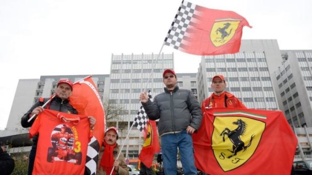 An AFP filephoto shows fans of Michael Schumacher in front of the Grenoble University Hospital Centre in January this year to mark his 45th birthday.