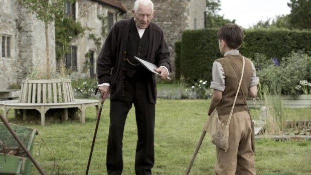 Ian McKellen and Milo Parker in the film <i>Mr Holmes</i>.