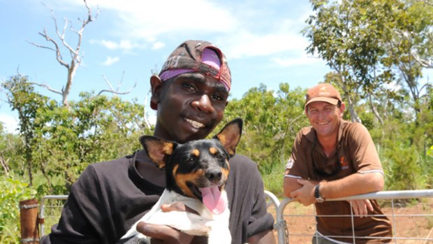 Second chance: Abel Banjo with dog Gizmo and youth worker Allan Brahminy at the Northern Territory camp.