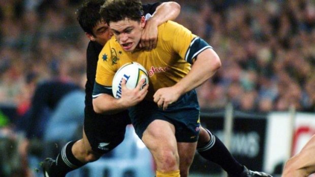 Action man: Wallaby utility Rod Kafer in the thick of the fray against the All Blacks in 1999.