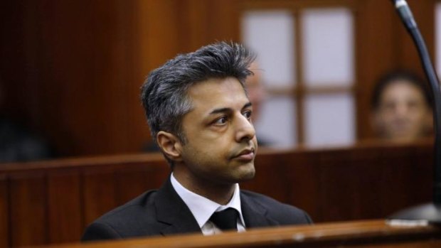 Shrien Dewani sits in the dock before the start of his trial in Cape Town.