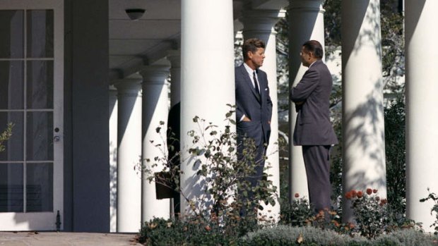Light and shade: President Kennedy confers with defence secretary Robert McNamara during the Cuban missile crisis.