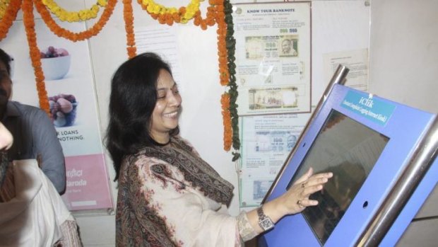 Lopamudra Baxipatra, head of the local Women's Commission, inaugurates the iClik kiosk at which women can register police complaints in the eastern city of Bhubaneswar.  