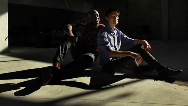 "A soaring song in human suffering": Actors DeObia Oparei and Luke Mullins of <em>Angels in America</em>.