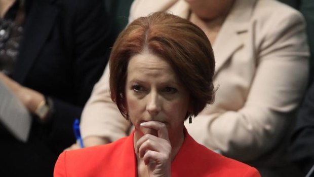 Prime Minister Julia Gillard listens to Liberal MP Michael Keenan speak during the debate about the Oakeshott  asylum seeker Bill.