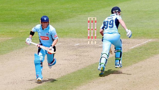 Timely ton: David Warner (left) moves towards his 139 for NSW in its Ryobi Cup loss to Queensland at North Sydney Oval.