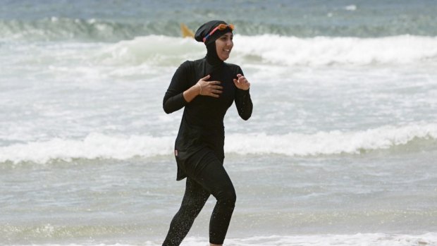 Modest swimwear. Woman in a burqini.