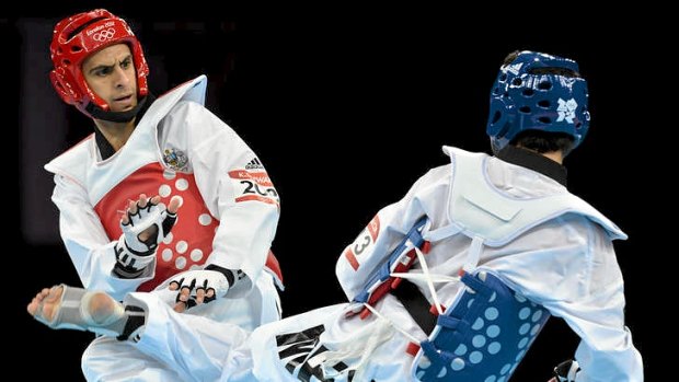 Australia's Safwan Khalil (L) fights during his first-round victory over Mexico's Diego Garcia De Leon in the men's taekwondo 58kg division at the London Olympics.