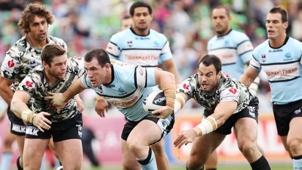 Focused on his day job, too ...    Gallen slips a tackle during last month’s match against Canberra. The Blues skipper believes last year’s Origin series marked the start of a turnaround for NSW.
