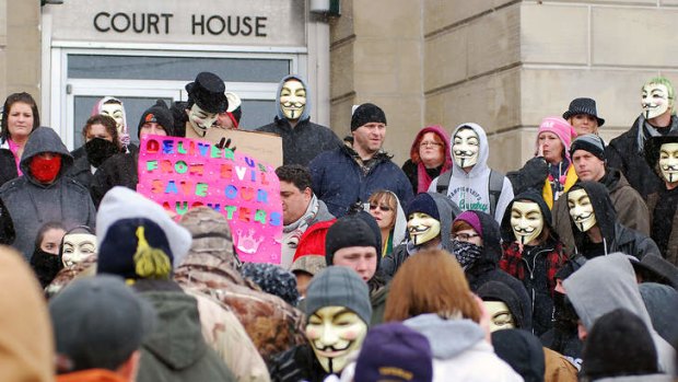 Outrage ... activists from the online group Anonymous rally at the Jefferson County Courthouse.