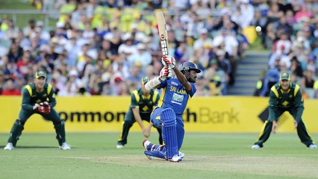 Take that: Sri Lanka's Lahiru Thirimanne hits out on his way to a century on Sunday night.