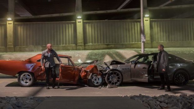 Vin Diesel as Dominic Toretto and Jason Statham, who plays Deckard Shaw, in <i>Furious 7</i>.