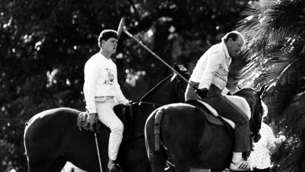 Like father like son .... Kerry Packer teaches his son, James, to play polo in March 1987.