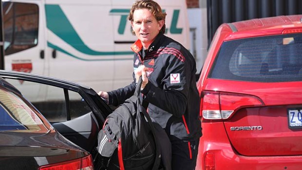 Coach James Hird arrives at Windy Hill on Tuesday.