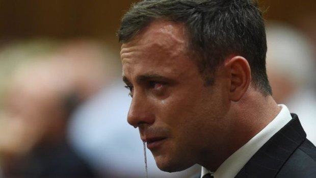 'Not guilty of murder' ... Oscar Pistorius reacts in the Pretoria High Court.