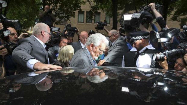 Guilty: Rolf Harris leaves the court after being found guilty of 12 counts of indecent assault.