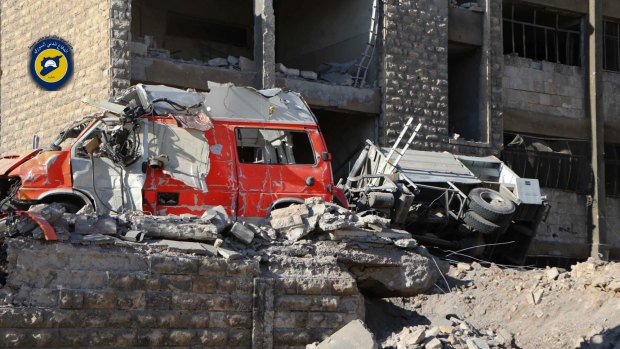 Destroyed ambulances are seen outside the Syrian Civil Defence main center after airstrikes in Ansari neighborhood in the rebel-held part of eastern Aleppo, Syria.