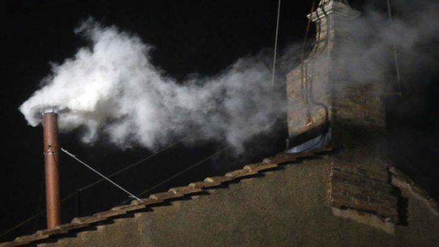 New pope elected: white smoke emerges from the chimney on the roof of the Sistine Chapel.