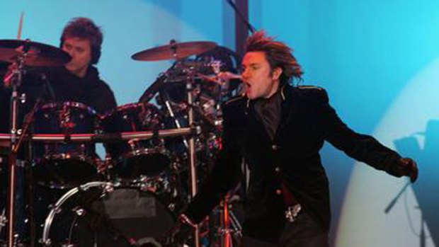 Duran Duran frontman Simon Le Bon performing live on stage.