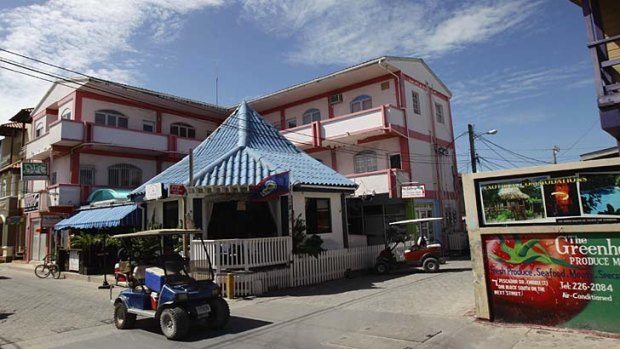 A man rides his buggy in the main square in San Pedro.