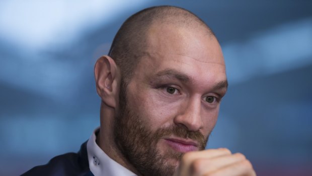 Newly crowned heavyweight world boxing champion Tyson Fury waits to answer questions as he hosts a media day in Bolton, England, Monday, Nov. 30, 2015. The 27-year-old Briton defeated 39-year-old Ukrainian Wladimir Klitschko in Dusseldorf, Germany on Saturday to become the WBA, IBF and WBO heavyweight champion. (AP Photo/Jon Super)