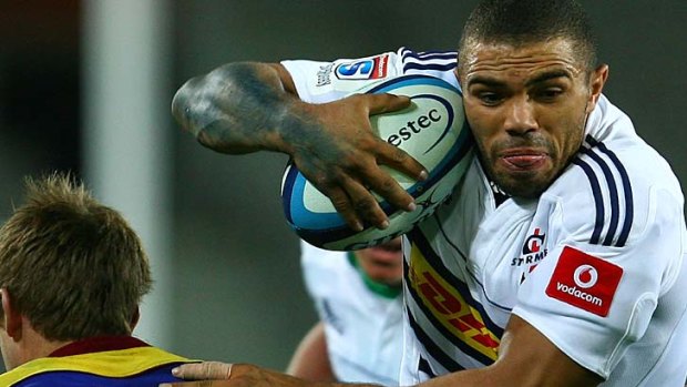 Bryan Habana of the Stormers attempts to blast past Chris Noakes of the Highlanders.