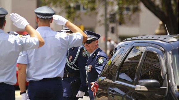 Police Commissioner Andrew Scipione arrives at the funeral of Detective Inspector Bryson Anderson.