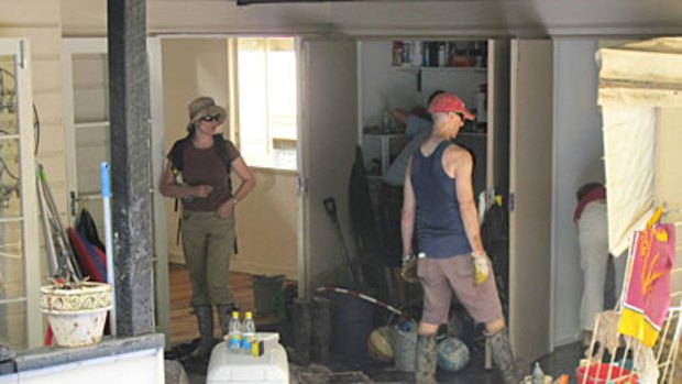 Volunteers rush to get the Moores' house clean before they return from holidays.