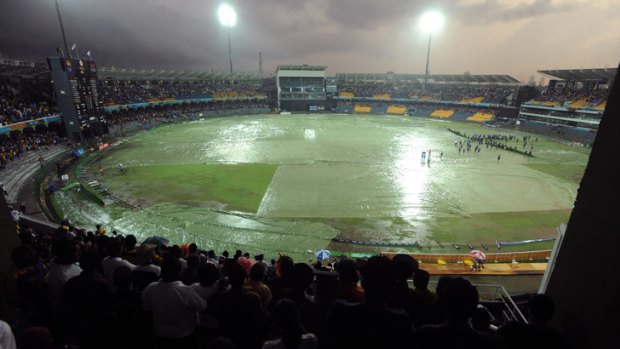 Covers protect the rain-soaked R Premadasa Stadium in Colombo, where Australia's match against Sri Lanka was washed out.