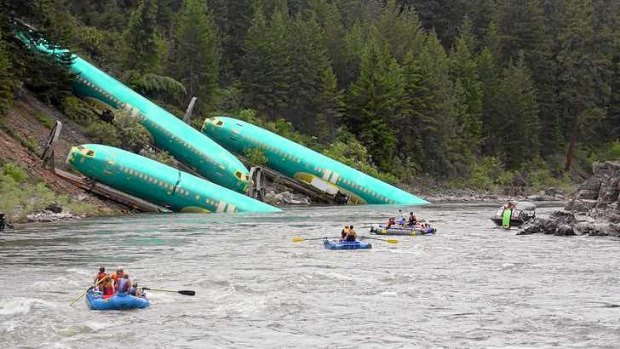 Three Boeing 737 fuselages lie on an embankment after a BNSF Railway train derailed near Rivulet, Montana.